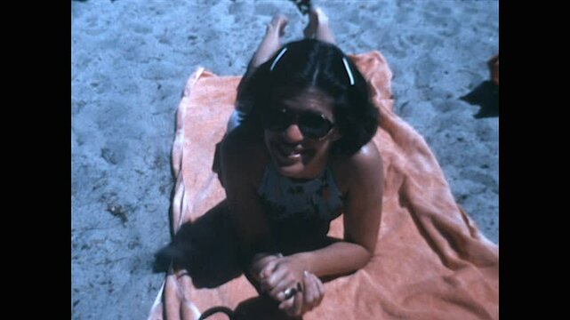 Sunbathing Woman 1978 - A woman lies on a towel at the beach in 1978. 