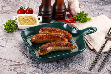 Delicous natural roasted sausages in the plate