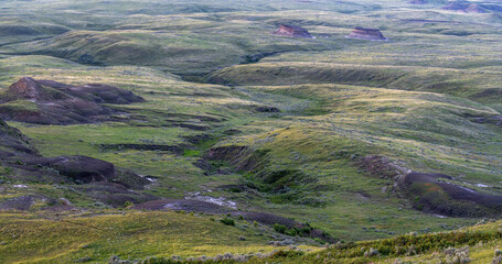 Sun setting over hilltops in the Valley of 1000 Devils in Grasslands National Park, Saskatchewan