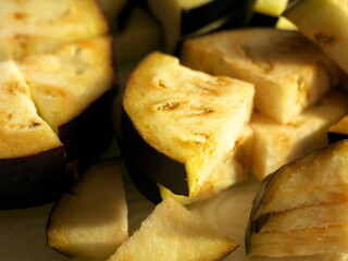 Close-up on raw eggplants cut into pieces