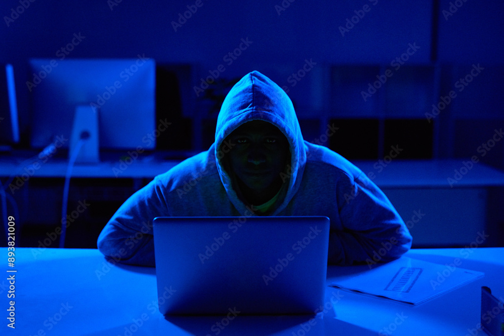 Poster person, hoodie or hacker with laptop for cybersecurity problem, malware or phishing for crime. progr