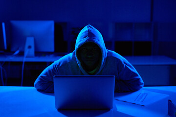 Person, hoodie or hacker with laptop for cybersecurity problem, malware or phishing for crime....