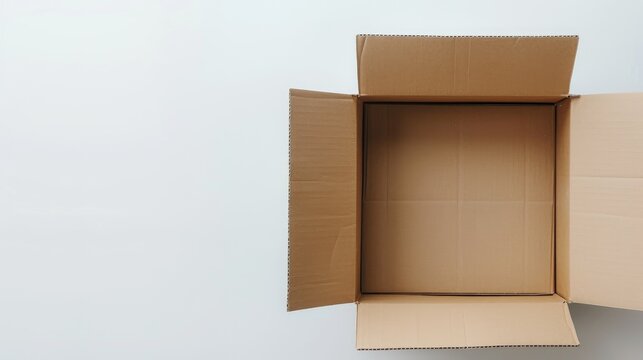White cardboard box with brown interior on white background with copy space