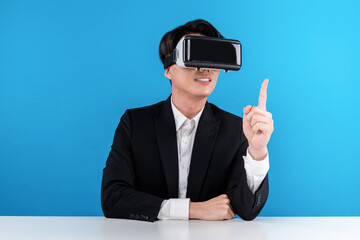Asian reporter looking thorough VR pointing to connect meta explaining business world news...