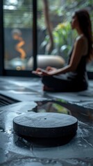 Woman meditating on illuminated platform with nature background.