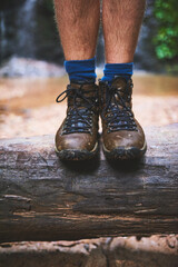 Shoes, outdoor and adventure in forest, person and trekking of athlete, nature and boots for hiking in environment. Jungle, travel and footwear in woods, tourism and river in Colombia and journey