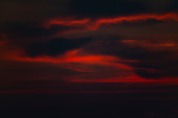 Dramatic fiery red clouds in the sky
