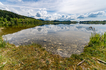 Leisurely hike in early summer at Rottachsee in the Allgau