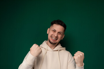 Man in White Hoodie Giving Thumbs Up