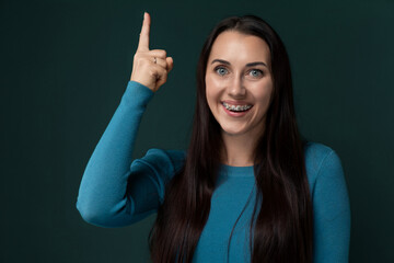 Woman With Long Black Hair Pointing to the Side