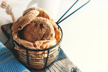 Delicious sweet chocolate chip cookies, homemade chocolate chip cookies with milk. Home comfort concept.