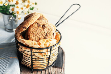 Delicious sweet chocolate chip cookies, homemade chocolate chip cookies with milk. Home comfort concept.