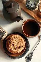Delicious sweet cookies with chocolate chips, homemade chocolate cookies with tea. Home comfort concept