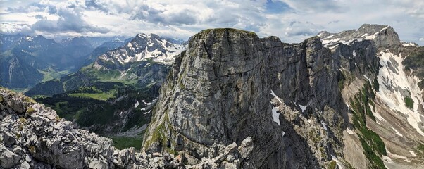 Via ferrata from Braunwald Glarus. Young men and women climbing the rock
climbs the rock up to the...