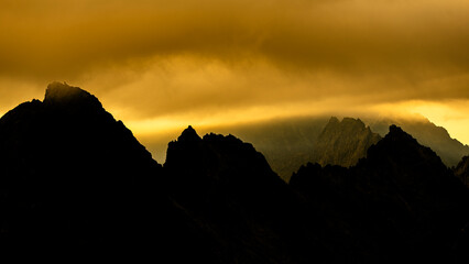 Dramatic sunrise over the Tatra Mountains. The Mount Ganek and Batizovsky Peak.