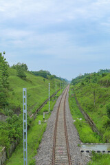 Fototapeta premium The railway line lies between the two hills
