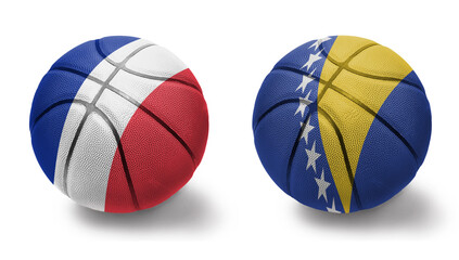 basketball balls with the national flags of bosnia and herzegovina and france on the white background.