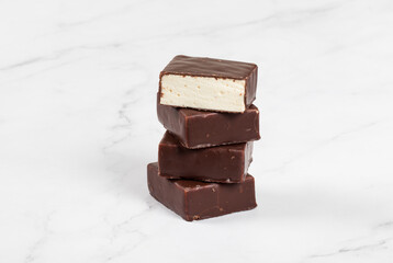 Bird's milk. Delicate dessert. Vanilla souffle in chocolate glaze. Close-up