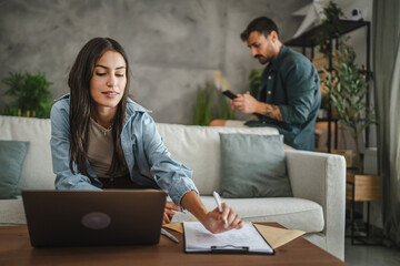 Adult young caucasian woman work from home and use laptop