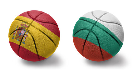 basketball balls with the national flags of bulgaria and spain on the white background.