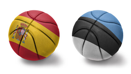 basketball balls with the national flags of estonia and spain on the white background.