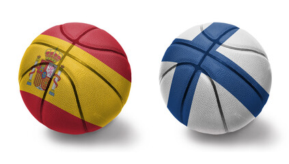 basketball balls with the national flags of finland and spain on the white background.