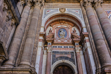 Obraz premium Architectural details of entrance to Malaga Cathedra. Cathedral is Roman Catholic Church (Santa Iglesia Catedral Basilica de la Encarnacion), was constructed in 1528 -1782. Malaga, Andalusia, Spain.