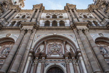 Fototapeta premium Architectural details of entrance to Malaga Cathedra. Cathedral is Roman Catholic Church (Santa Iglesia Catedral Basilica de la Encarnacion), was constructed in 1528 -1782. Malaga, Andalusia, Spain.