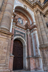 Fototapeta premium Architectural details of entrance to Malaga Cathedra. Cathedral is Roman Catholic Church (Santa Iglesia Catedral Basilica de la Encarnacion), was constructed in 1528 -1782. Malaga, Andalusia, Spain.