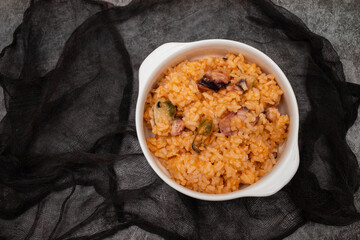 traditional portuguese dish rice with seafood in white dish