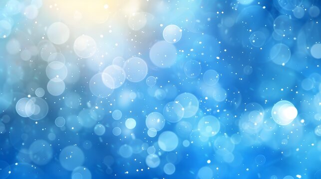 A serene blue bokeh background with soft light and circular patterns creates a dreamy and calming atmosphere for various design projects. 