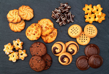 Mix of cookies . Many unhealthy snacks . Top view