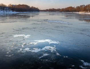 A frozen river with a lot of ice on it