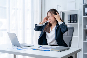 Young businesswoman is having problems with her work at work. Feeling stressed and unhappy because the results did not meet the goals