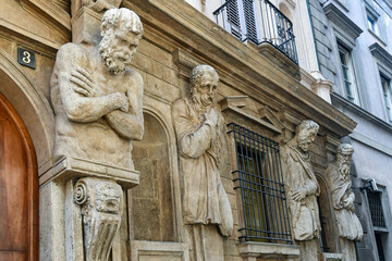Fototapeta premium Detail of the facade of the Casa degli Omenoni, a historic palace built in 1565 and decorated by eight atlantes (