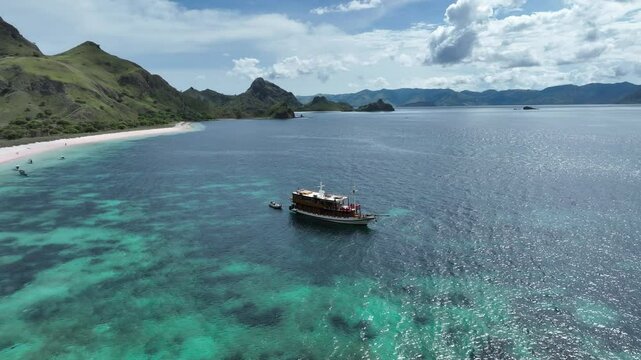 Aerial video of live aboard boat moored in front of Padar Island, komodo national park, indonesia