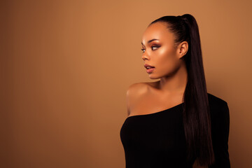 Profile portrait of charming attractive girl pole dance trainer looking promo empty space on beige color background © Beauty Hero