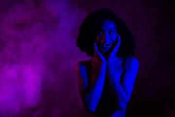 Photo of excited girl naked shoulders enjoy night club festive empty space isolated neon purple color background