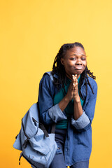 Friendly african american woman putting hands together in apology gesture, asking for forgiveness....