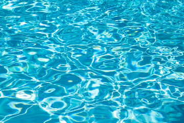 Pool water surface. Water texture. Swimming pool surface. Blue water background. Background of swimming pool water surface.