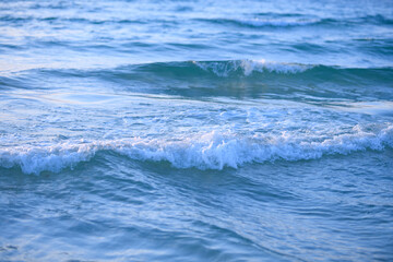 Ocean or sea waves. Coast with sandy beach with sea waves. Ocean beach vacation. Ocean waves and beach background.