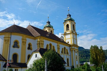 Naklejka premium Clouds drift over Innsbruck, a city nestled in the Austrian Alps