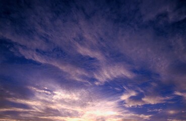 Cirrus Clouds And Sunlight