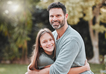 Obraz premium Hug, park and portrait of dad with child for bonding, relationship and relaxing together outdoors. Family, smile and happy father embrace daughter in nature for affection, care and love on weekend