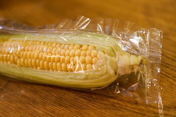 Fresh corn in a plastic bag. Close up 