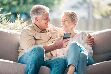 Senior, couple, smile and sofa with phone for browsing social media, streaming video and reading...