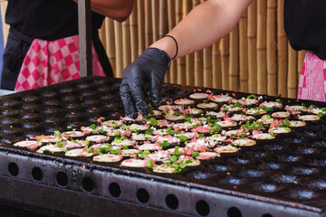 Cooking Takoyaki On Special Molded Pan