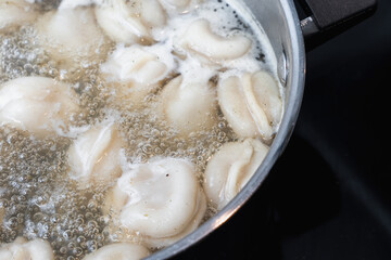 Close-Up Of Boiling Pelmeni Dumplings