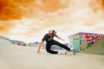 Teenager Falling Off His Skateboard