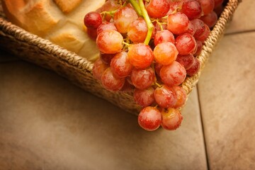 A Close-Up Of Red Grapes And Bread